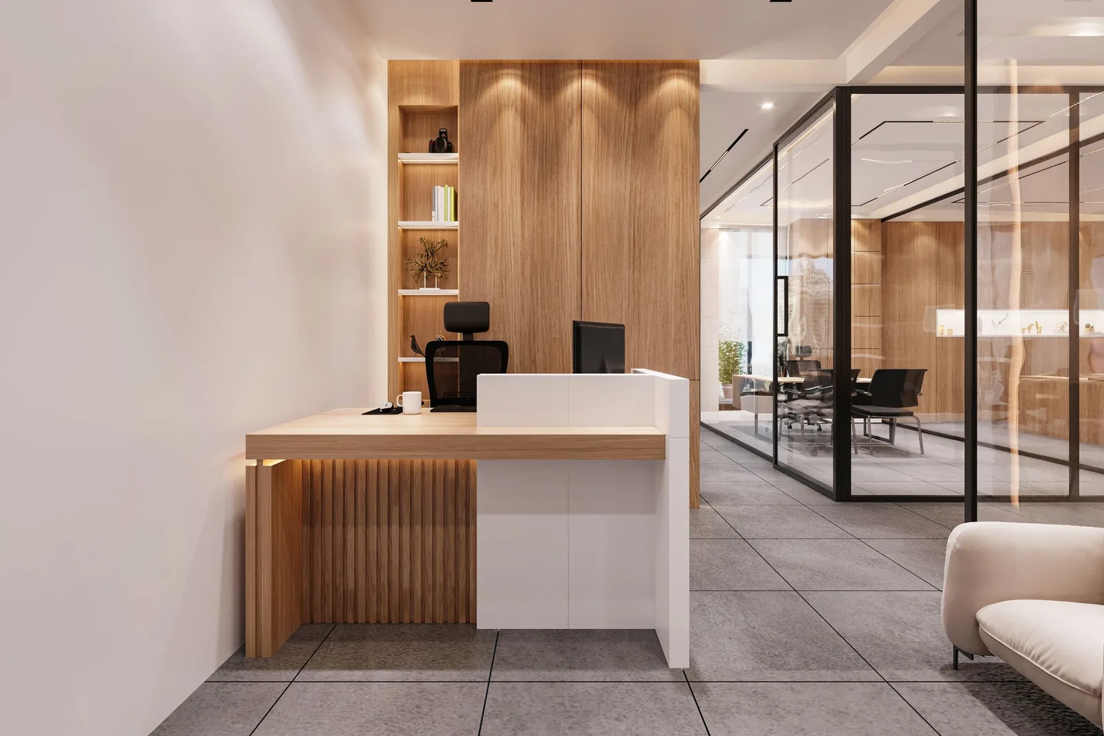 Contemporary office reception desk with wood paneling and a glass-walled meeting room beyond
