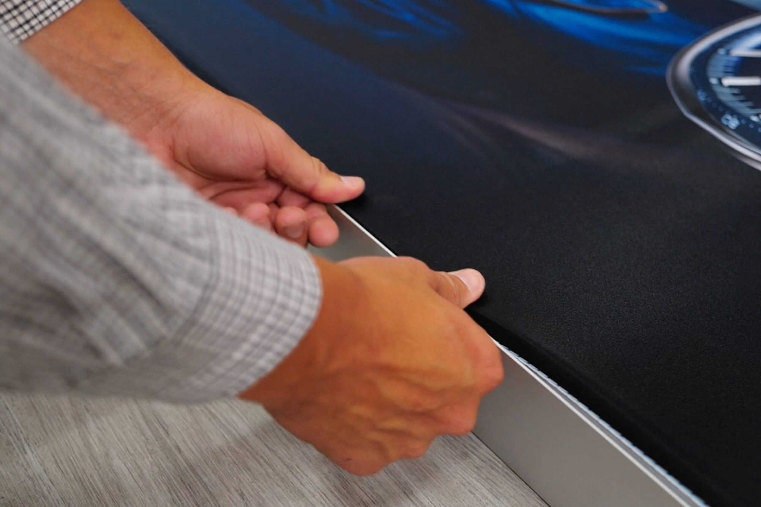 SEG fabric installation onto aluminium frame during real assembly